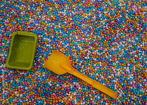 Playground with colorful mini gravel theme with play equipment accessories