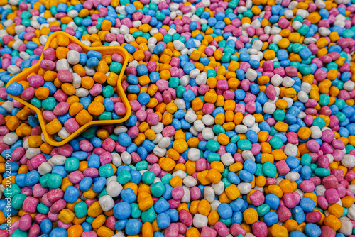 Playground with colorful mini gravel theme with play equipment accessories