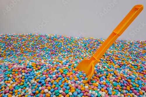 Playground with colorful mini gravel theme with play equipment accessories