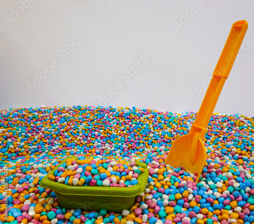Playground with colorful mini gravel theme with play equipment accessories