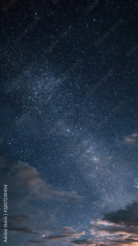 Obraz premium Starry Night Sky with Clouds and Milky Way Galaxy