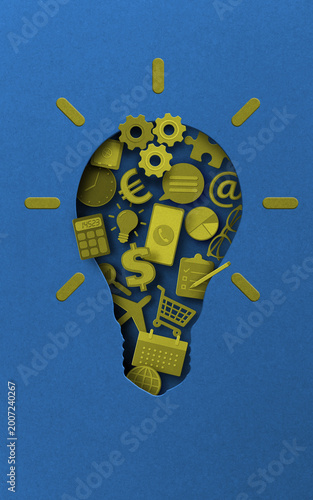 Light bulb with business icons symbolizing creative ideas