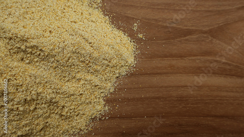 Fotografía Top View Closeup of Corn Flour on Wooden Surface with Copy Space