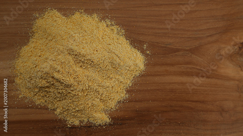 Cuadro en lienzo Top View of Corn Flour on Wooden Surface with Copy Space