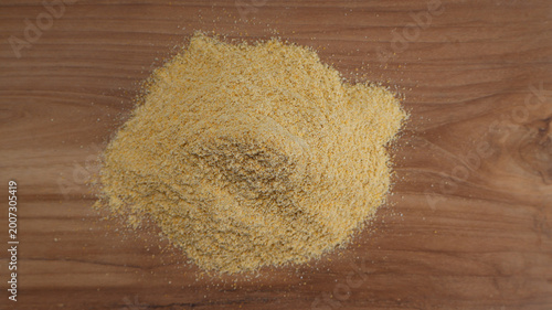 Obraz na plátne Top View of Corn Flour on Wooden Surface