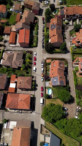 Aerial View of a Quaint Suburban Street: An elevated perspective unveils a charming street lined with homes, offering a bird's-eye view of community life.