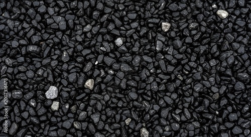 Close-up Macro Shot of Dark Black Gravel Pebbles Texture Background.
