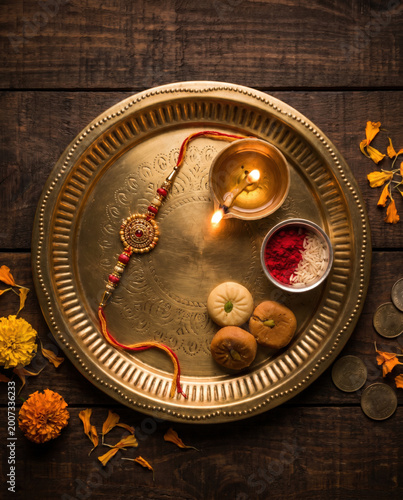 Raksha Bandhan Thali with Rakhi, Sweets, and Diyas