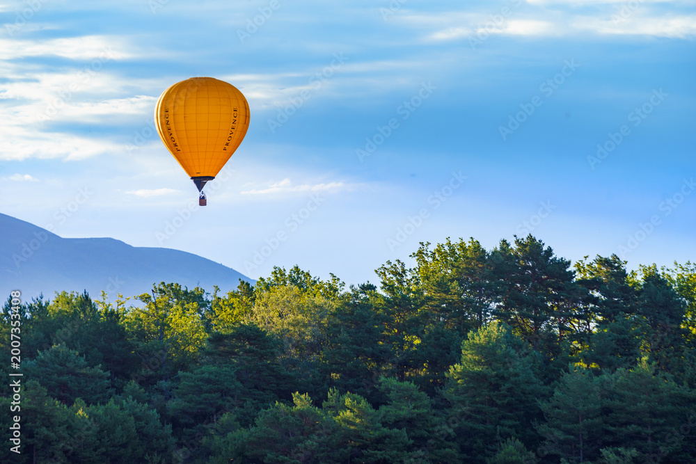 Naklejka premium Hot air balloon flying in sky. Provence in France. Tourism and adventure concept.