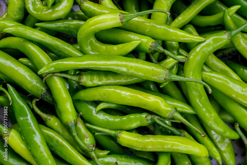 Fresh chilies or chili peppers background. Spicy vegetable. Also called Mirchi or Paprika.