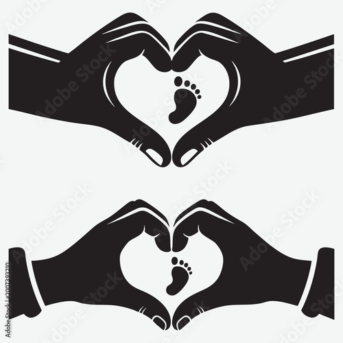Two silhouette of hands forming a heart shape around a small baby footprint