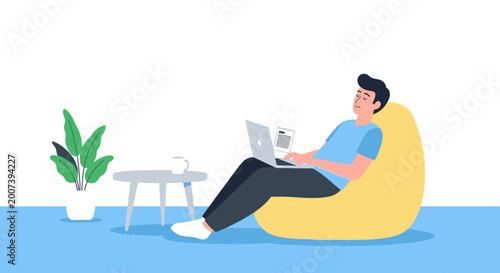 Foto Man working on laptop in a beanbag chair at home
