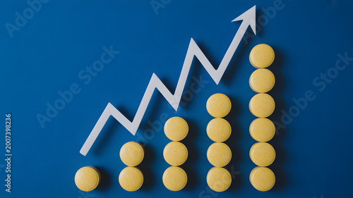 A graph showing an upward trend with yellow pills and a white arrow on a blue background
