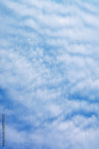 Vertical background with light cloudiness in the sky