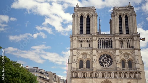 Iconic notre dame cathedral facade exterior shot showing historic gothic architecture in paris france.
