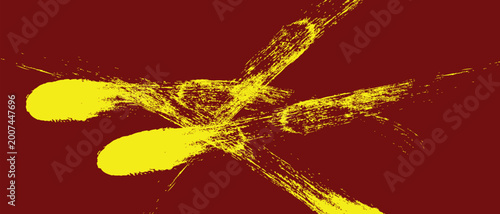 Photos Vibrant yellow paint splatters on dark red background with grunge brush stroke compositions