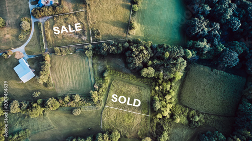 Rural land surveying with drone maps highlighting sale and sold properties
