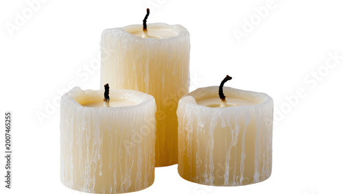 Canvas-taulu Three unlit cream-colored pillar candles with melted wax drips, isolated on tran