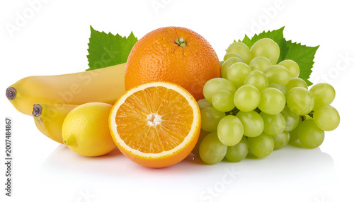 Fresh assorted fruits with orange grapes bananas and lemon on white background.