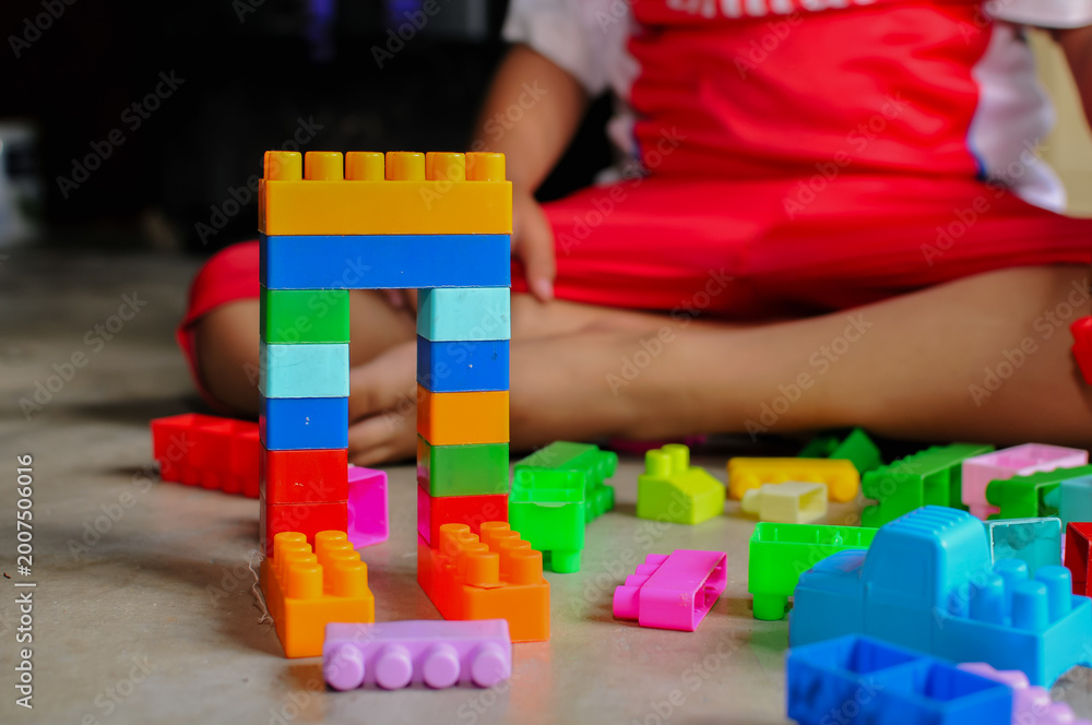 Fototapeta premium child playing with blocks