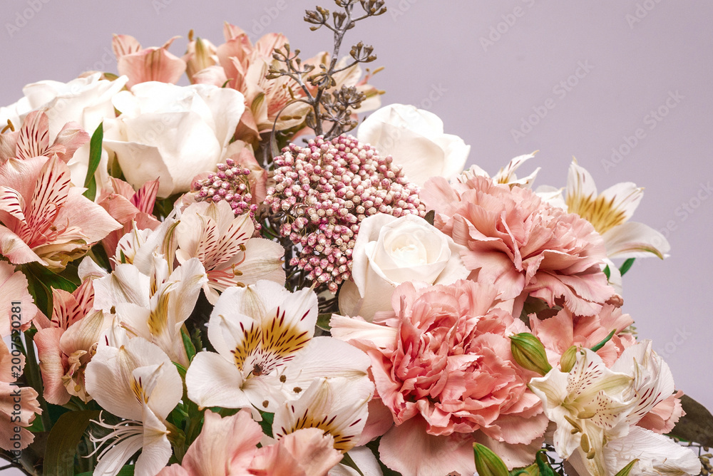Fototapeta premium Bouquet of soft pink flowers in wrapping paper.