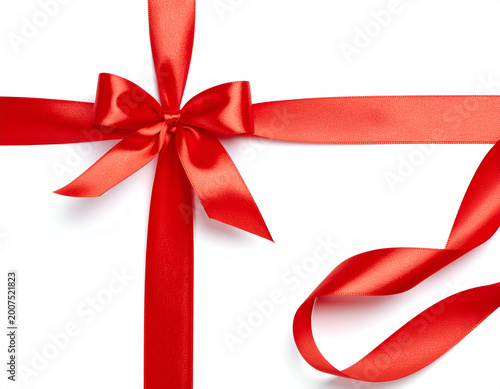 A vibrant red ribbon is elegantly tied into a bow on a pristine white background.