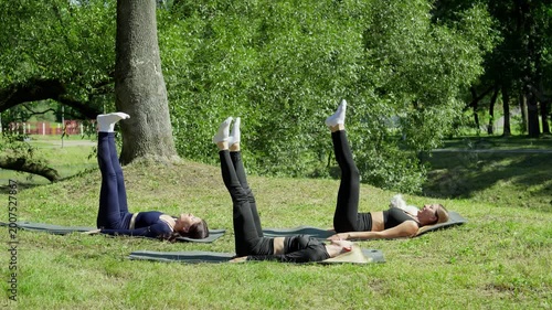 Outdoor fitness. Female athletes training outdoors. Fitness at sunny morning. Fit woman during fitness routines. Healthy lifestyle concept. 4K, UHD
