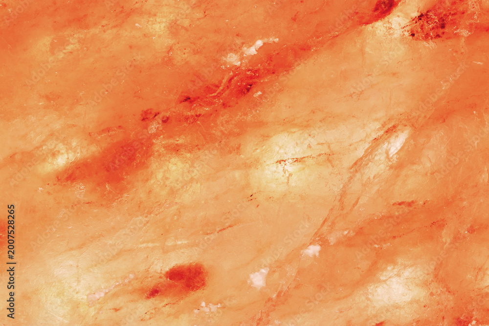 Fototapeta premium Natural Himalayan salt surface with organic crystal structure and warm tones. Concept of wellness, clean beauty aesthetics. Mineral texture salt slab nature background, pink peach monochrome.