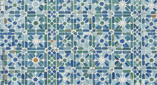 Intricate Geometric Pattern of Blue and Green Moroccan Tiles.