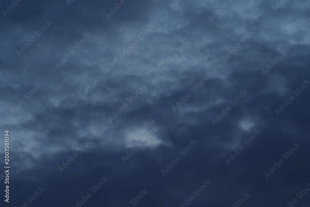 Fototapeta premium Dramatic summer sunset sky with cumulus clouds, colorful evening light and atmospheric cloudscape.