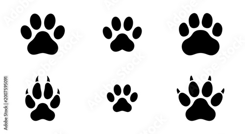 Foto vector silhouette set of dog paw prints on white background various sizes and or