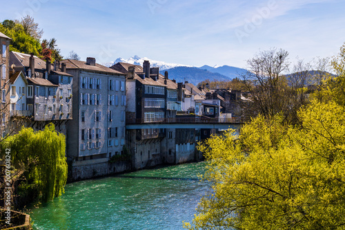 Houses along the Gave d'Aspe river in Oloron-Sainte-Marie in spring