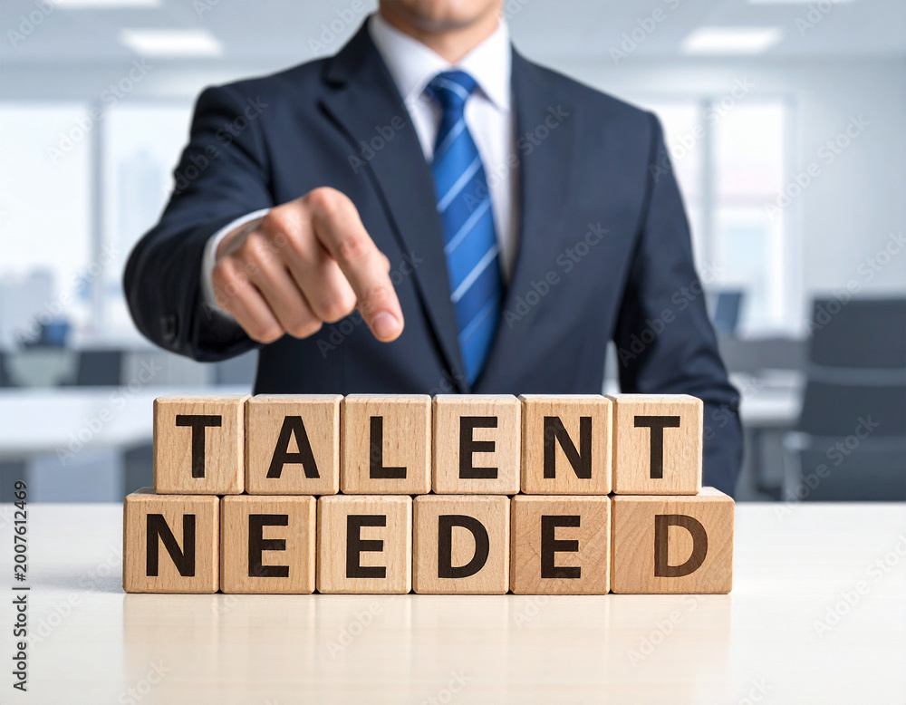 Fototapeta premium Talent needed - Geschäftsmann zeigt auf den Text 