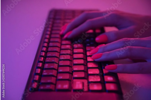 Close up of male hands typing on a vintage mechanical computer keyboard