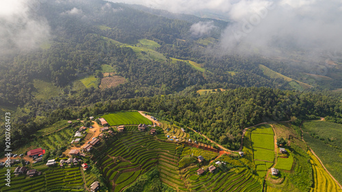 A scenic view of Pa Bong Piang rice terraces showcases the harmony between traditional farming and mountainous landscapes in northern Thailand.