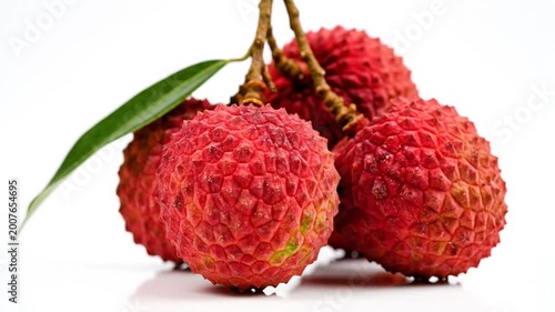 Fresh Red Lychee Cluster Rotating On Isolated White Background