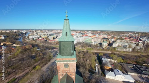 Aerial 4K: Ascending next to Turku Cathedral Tower with City Panorama Reveal