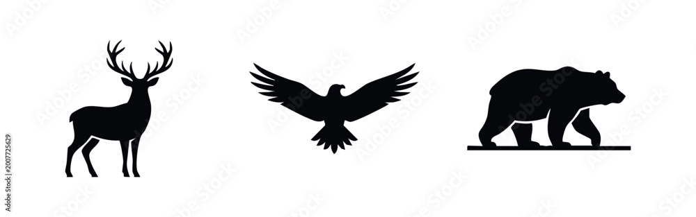 Fototapeta premium Minimalist black silhouettes of a deer with antlers, a flying eagle, and a walking bear isolated on a white background.