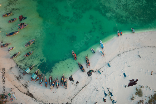Tanzania's Zanzibar Island, as seen from above, with fishing boats and the turquoise ocean floor 