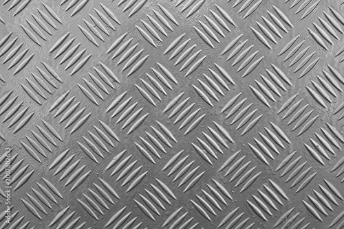 Industrial silver diamond plate metal texture background close up