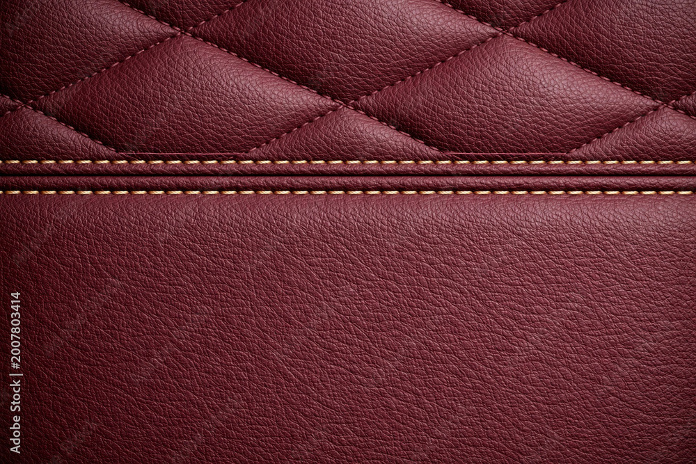 Obraz premium Elegant Burgundy Leather Surface Texture Featuring Luxury Diamond Quilted Pattern Combined Smooth Panel Separated Genuine Double Stitching Accents Automotive Interior Material Detailed Design