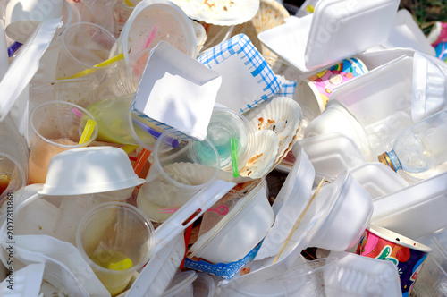 Pile of single-use plastic waste including cups, straws, and foam. Garbage pile, Plastic waste, Pollution, containers highlighting environmental pollution and urgent need to reduce plastic consumption