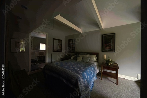 Foto Interior bedroom space featuring a bed with a detailed patterned blue coverlet, a side table, and framed art pieces on the walls