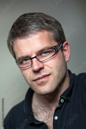 Portrait of a young man inside house