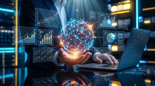 Businessman holding digital network globe with holographic financial charts and global data visualization over laptop