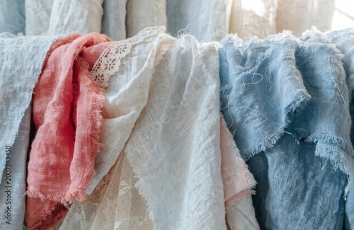 Linen fabric layers in pale red, white, and blue, shabby chic, cozy textile background