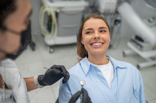 Dentist examining patient teeth closeup