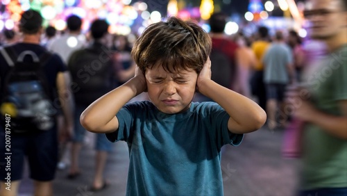 Child Covering Ears in Noisy Environment, Sensory Overload and Emotional Distress Concept, Bright Chaotic Background