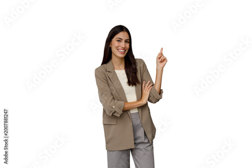 Canvas-taulu Professional business woman smiling and pointing finger up, indicating something