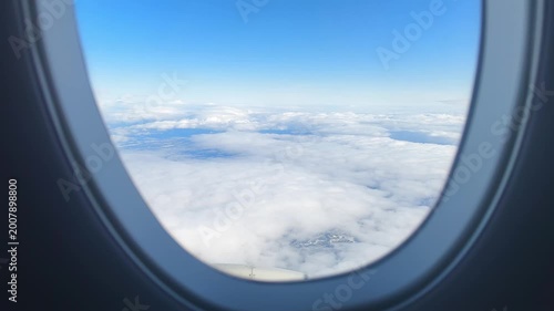 Serene Sky Over Layered Cloud Formations. Passengers View Tranquil Blue Sky With Soft Clouds Above. Peaceful Airplane Perspective Showing Calm Clouds And Minimalist Horizon In Cool Hues